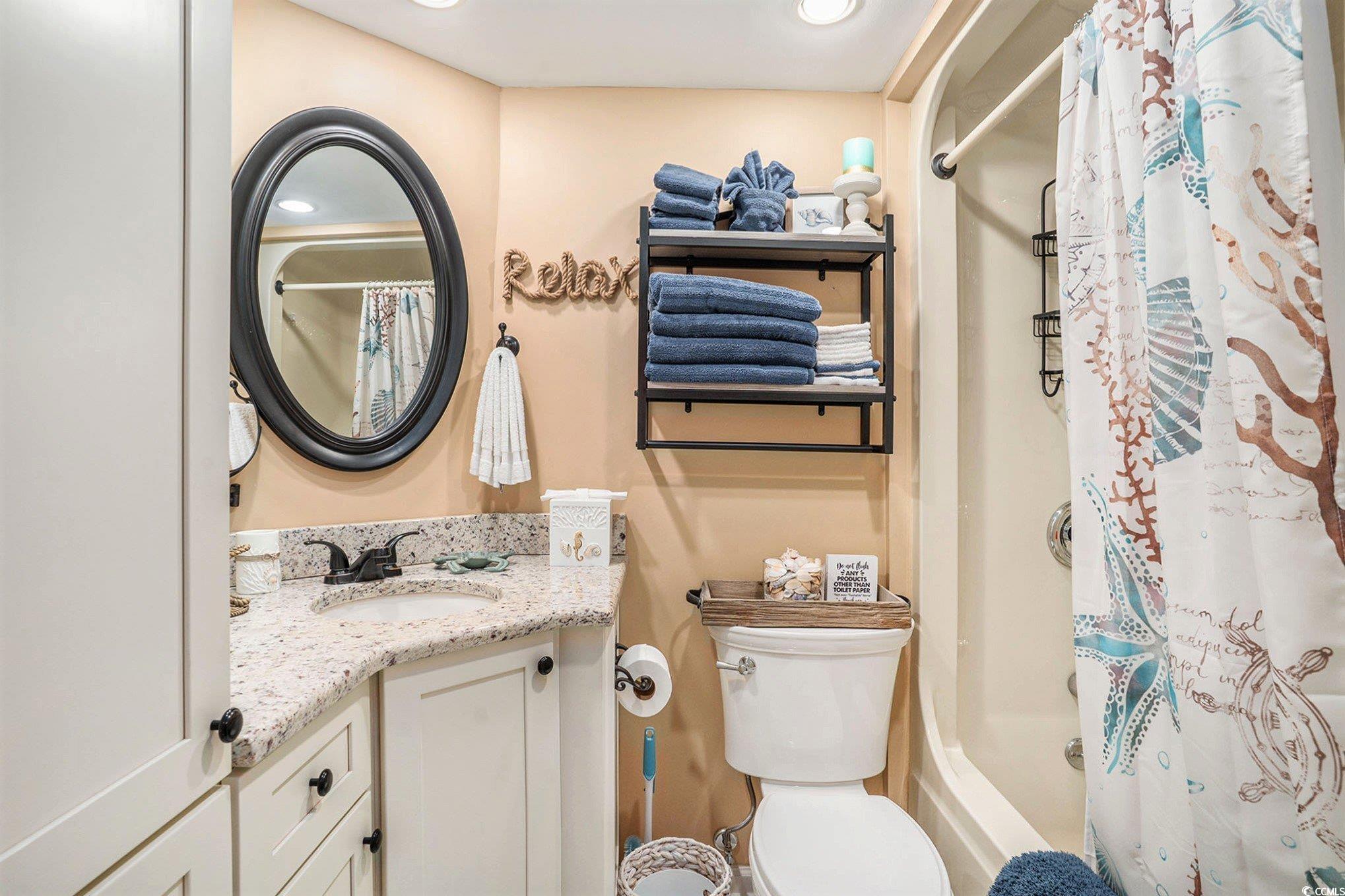 2406 North Ocean Boulevard, Unit 1203 Myrtle Beach, SC 29577 - Photo 12 of 24 Bathroom featuring vanity and toilet