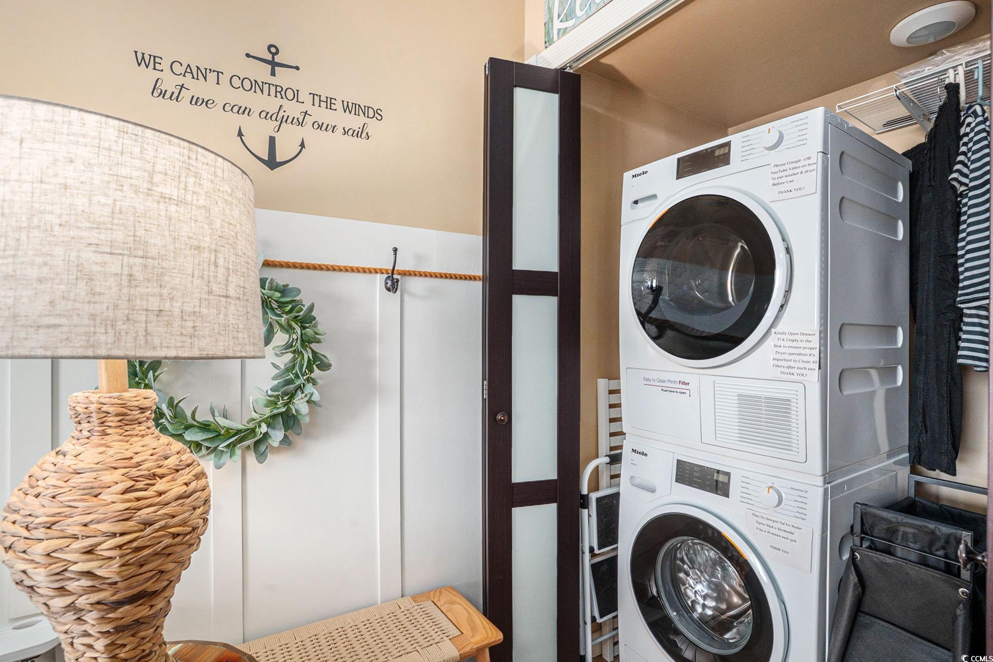 2406 North Ocean Boulevard, Unit 1203 Myrtle Beach, SC 29577 - Photo 17 of 24 Laundry area featuring estacked washer and dryer