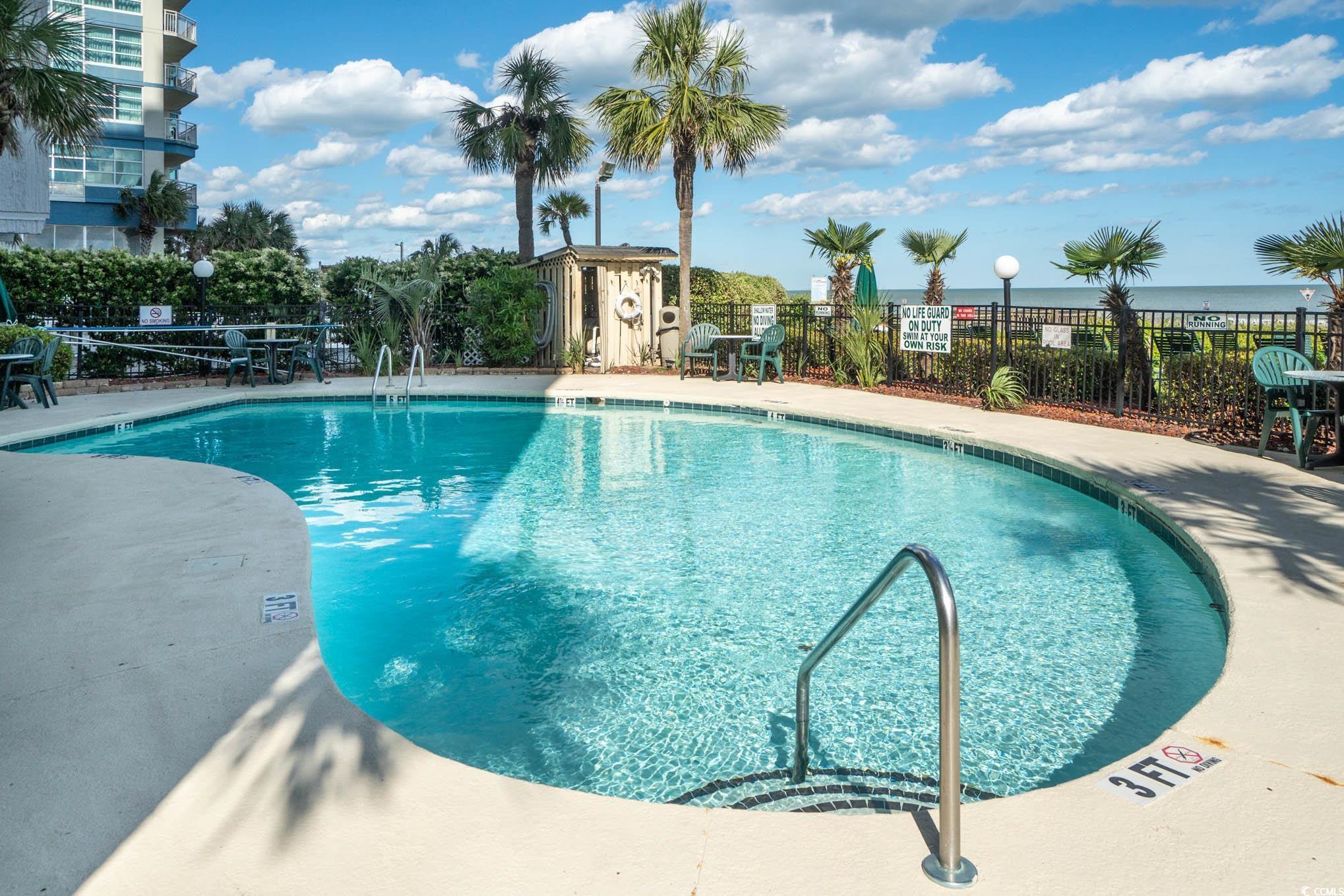 2406 North Ocean Boulevard, Unit 1203 Myrtle Beach, SC 29577 - Photo 18 of 24 Community pool with a patio