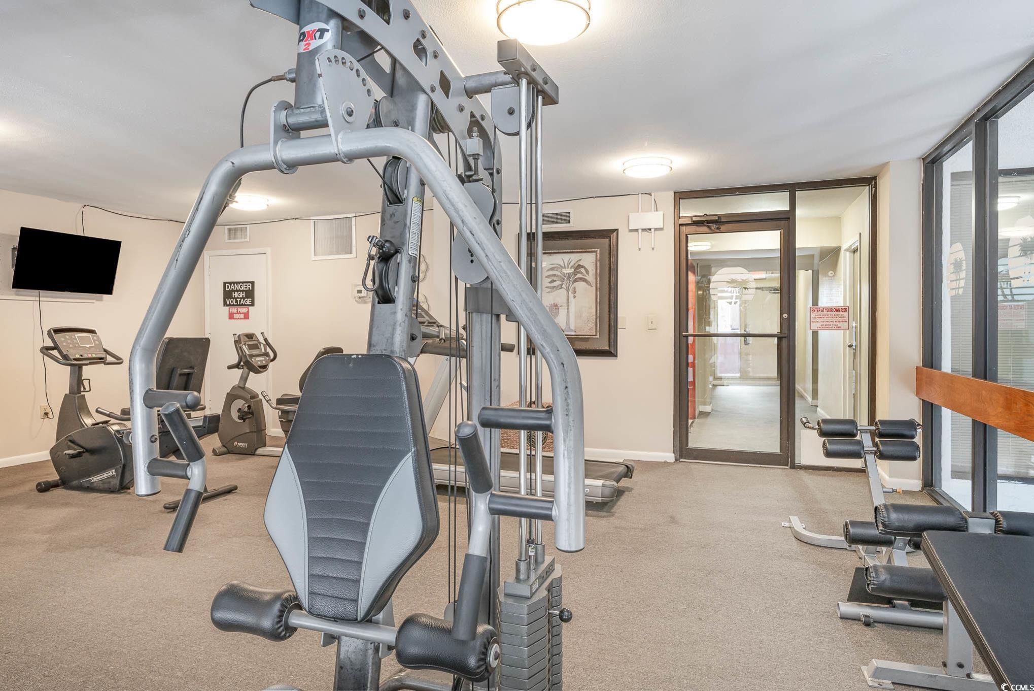 2406 North Ocean Boulevard, Unit 1203 Myrtle Beach, SC 29577 - Photo 21 of 24 Workout area with floor to ceiling windows