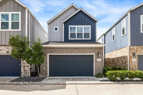 a front view of a house with garage