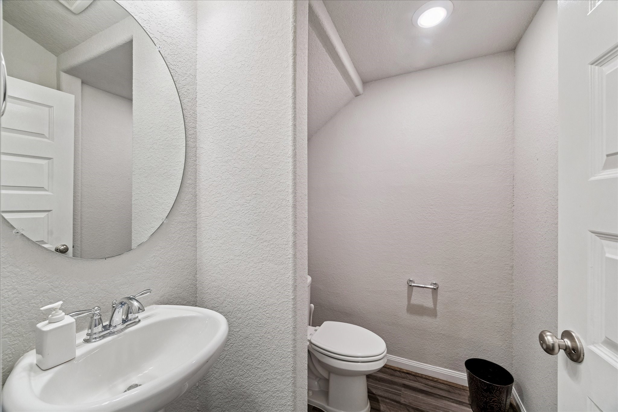 5502 Cuerta Street Houston, TX 77023 - Photo 9 of 25 a bathroom with a sink toilet and a mirror