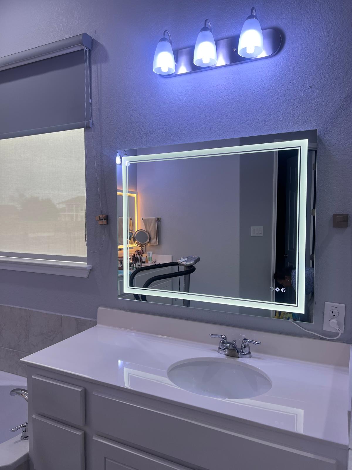 1837 Halflinger Lane Leander, TX 78641 - Photo 16 of 39 Bathroom featuring vanity, a garden tub, and a textured wall