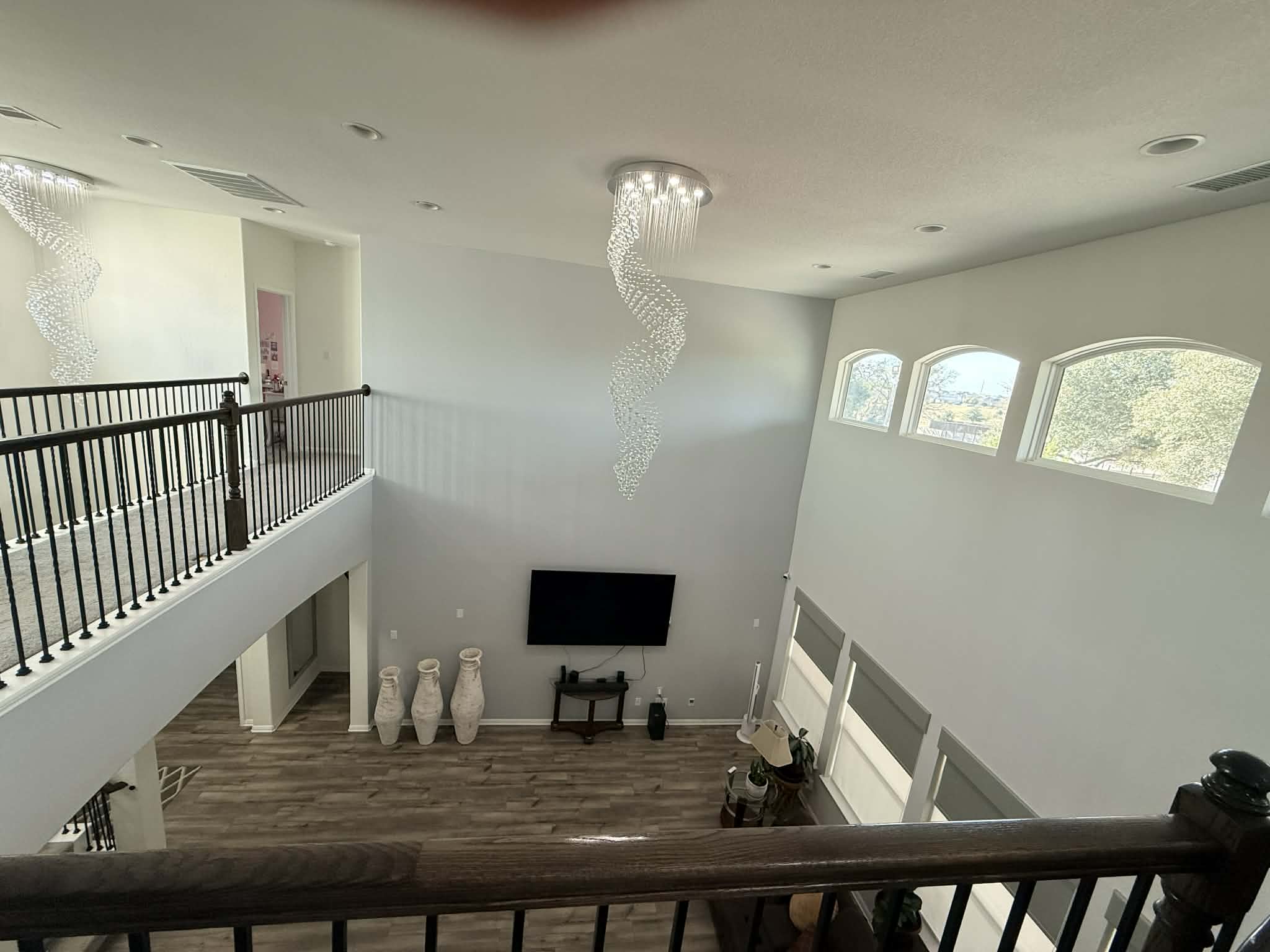 1837 Halflinger Lane Leander, TX 78641 - Photo 20 of 39 Staircase featuring wood finished floors and a high ceiling