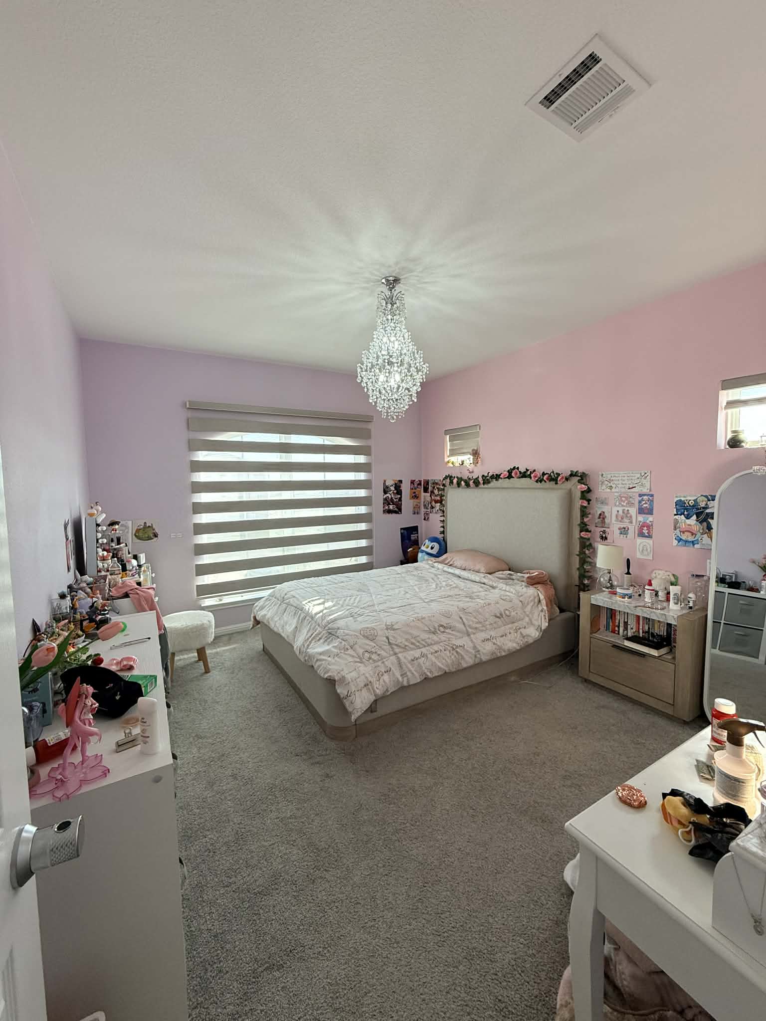 1837 Halflinger Lane Leander, TX 78641 - Photo 21 of 39 Carpeted bedroom featuring multiple windows and a chandelier