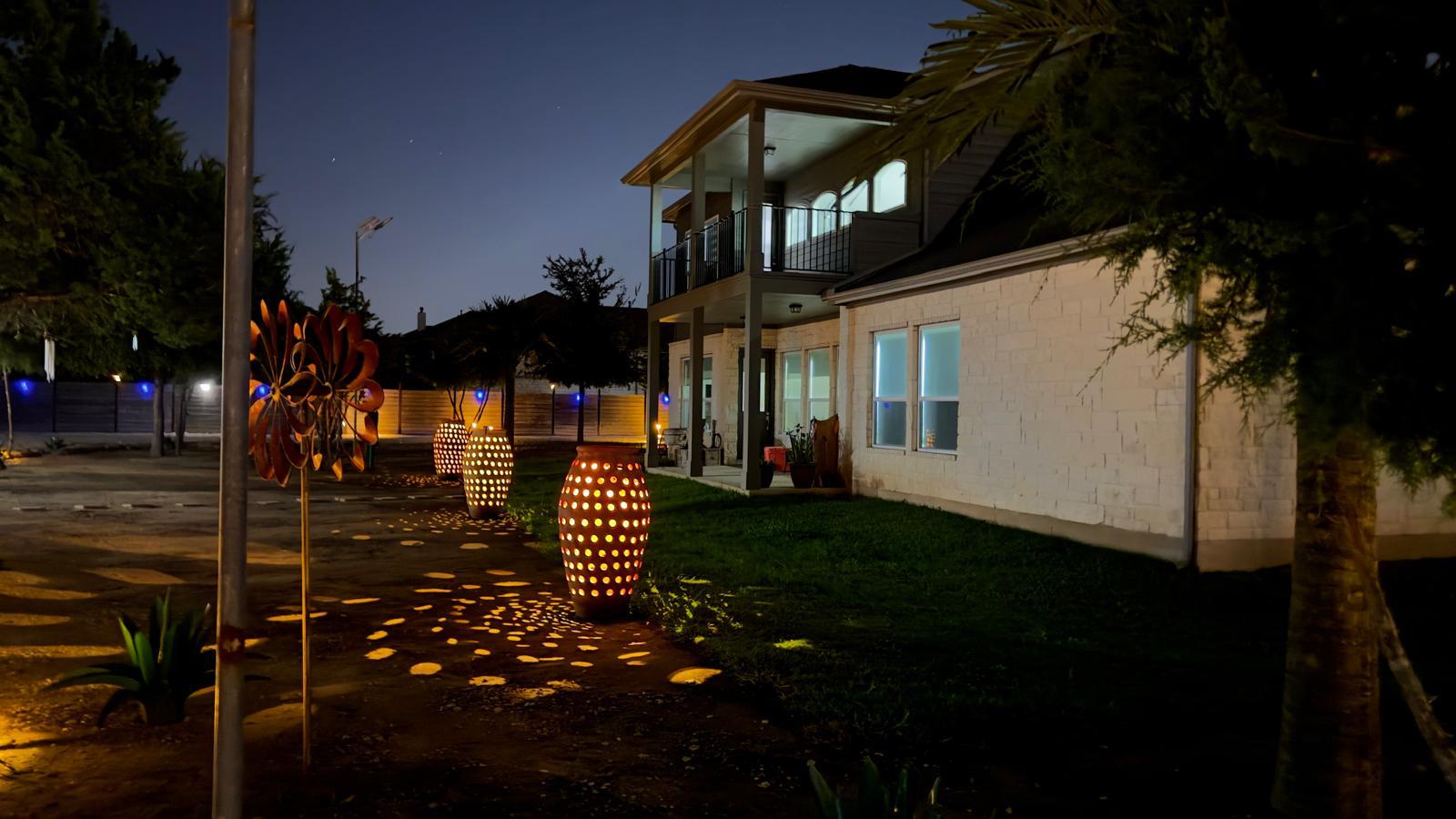 1837 Halflinger Lane Leander, TX 78641 - Photo 39 of 39 Yard at night featuring a balcony, a patio, and a yard