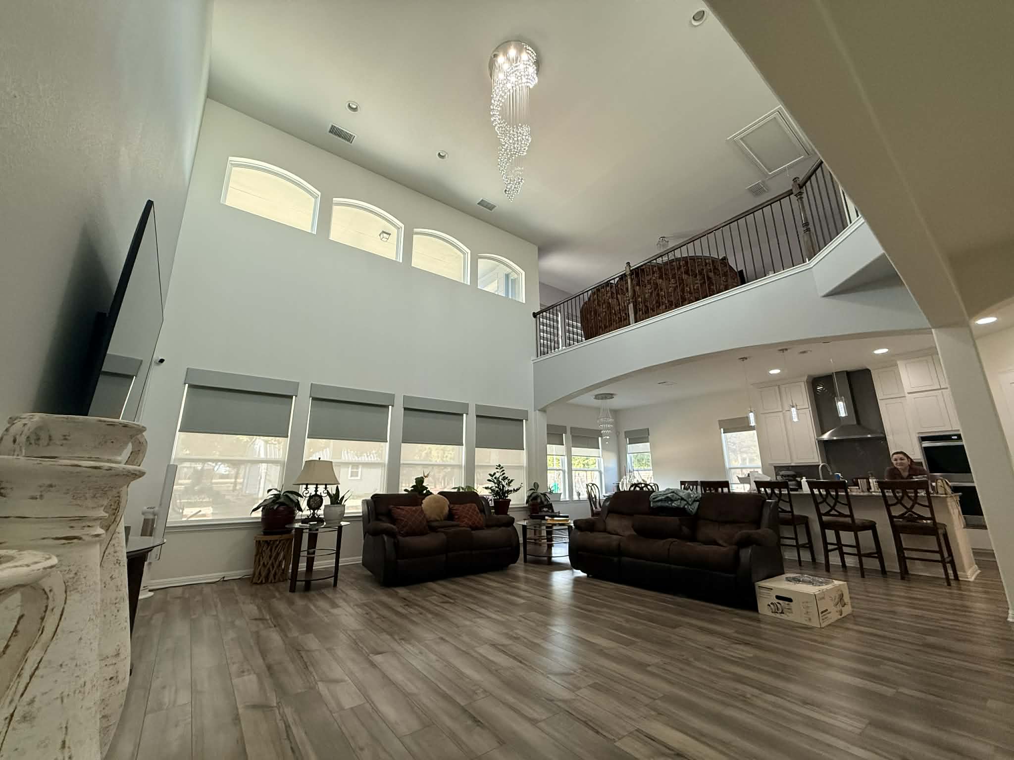 1837 Halflinger Lane Leander, TX 78641 - Photo 5 of 39 Living area with arched walkways, recessed lighting, dark wood finished floors, and a high ceiling