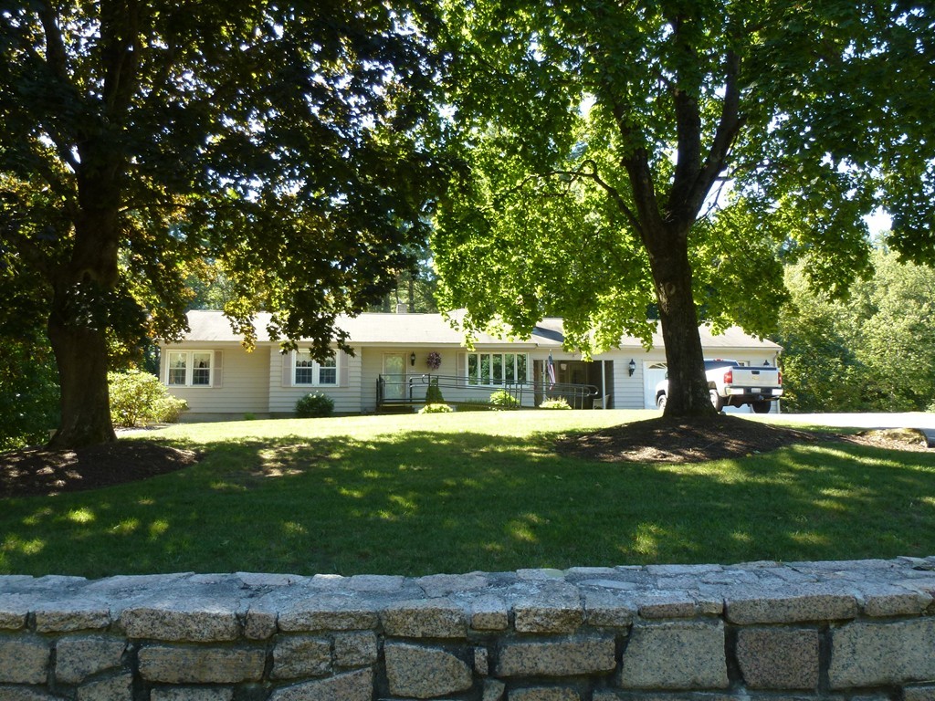 134 Dunstable Road North Chelmsford, MA 01863 - Photo 1 of 26 a view of a house with a yard