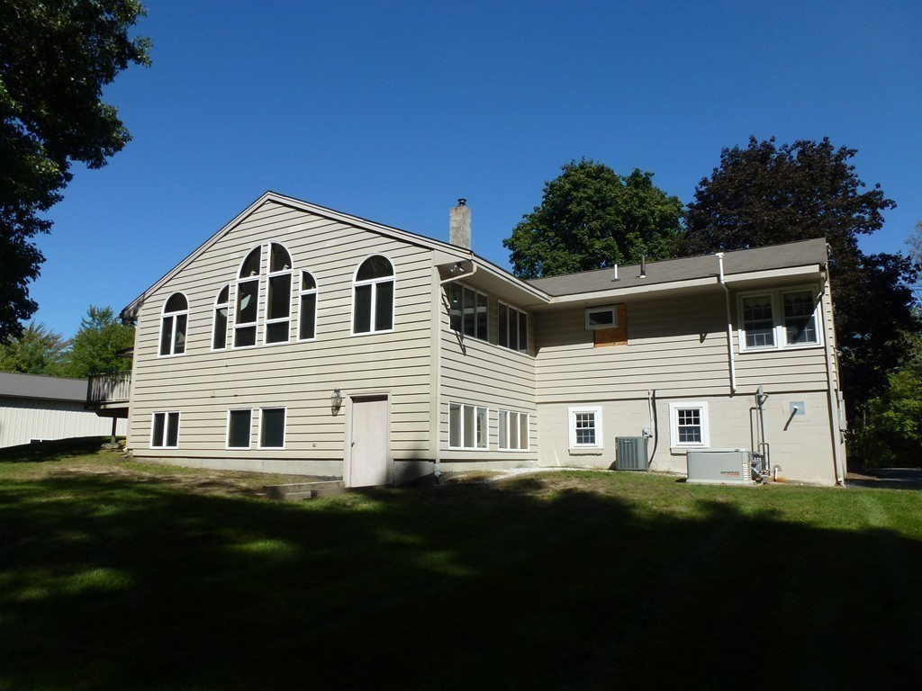134 Dunstable Road North Chelmsford, MA 01863 - Photo 19 of 26 a front view of a house with a garden