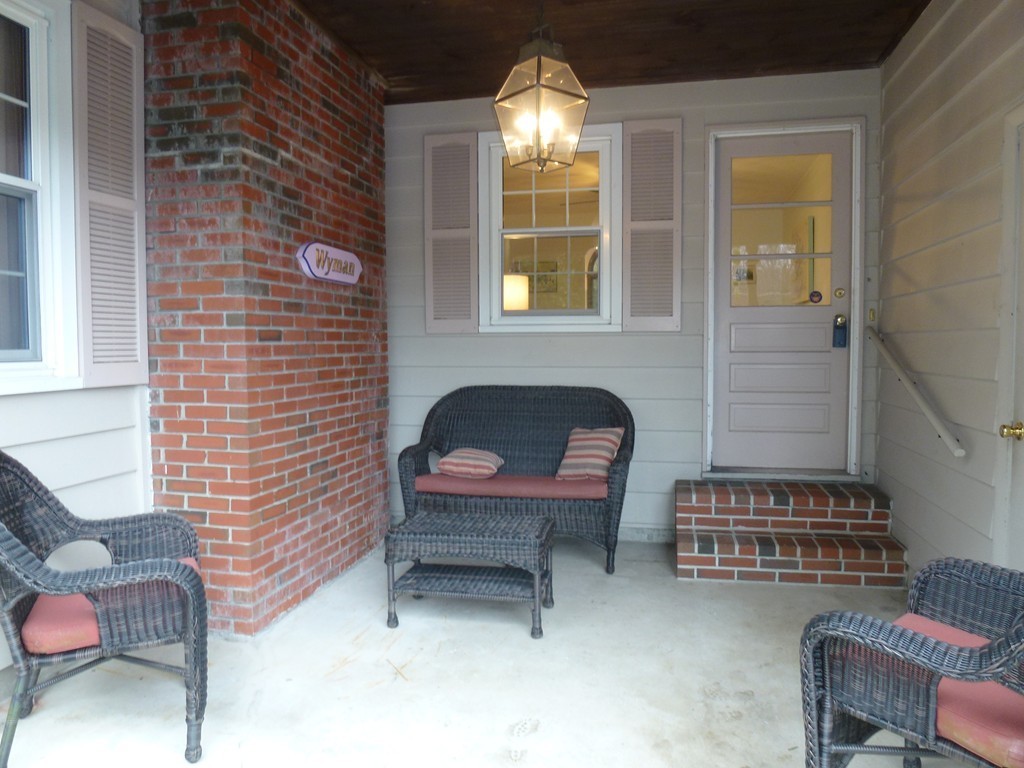 134 Dunstable Road North Chelmsford, MA 01863 - Photo 2 of 26 a room with furniture and a fireplace