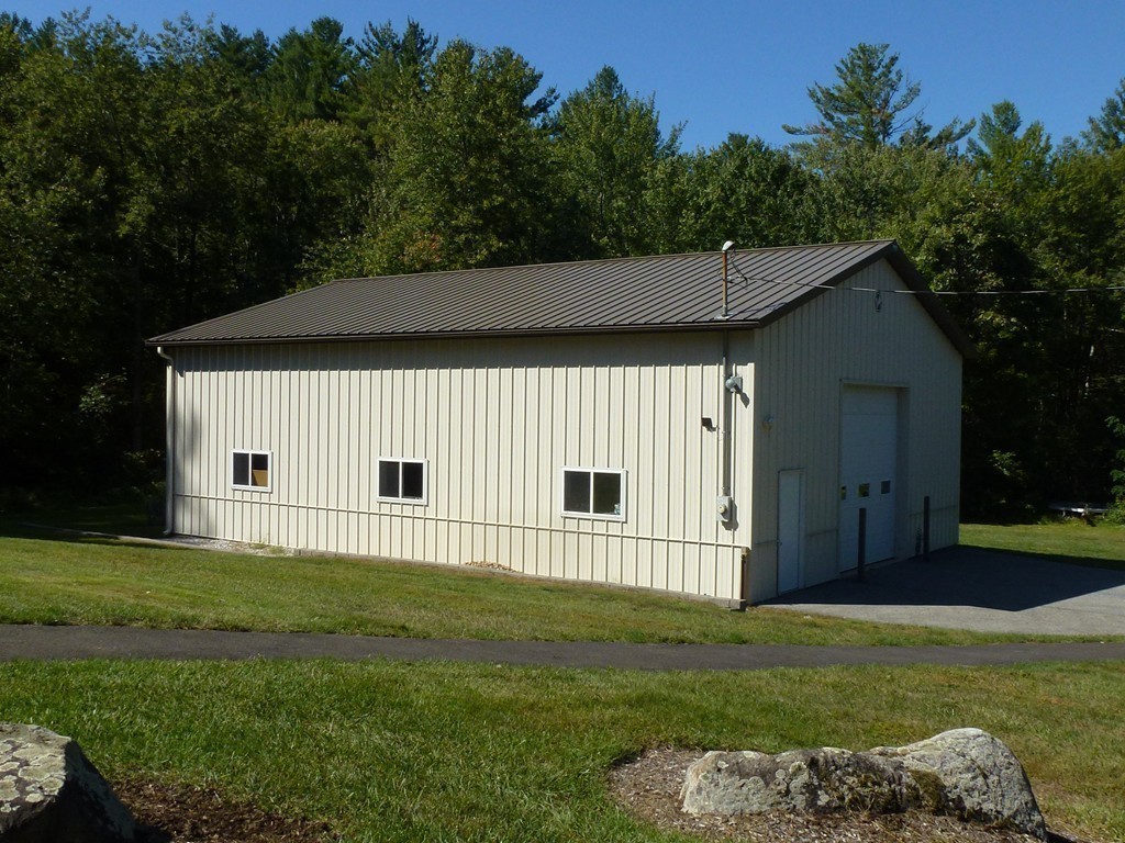 134 Dunstable Road North Chelmsford, MA 01863 - Photo 22 of 26 a front view of a house with a garden