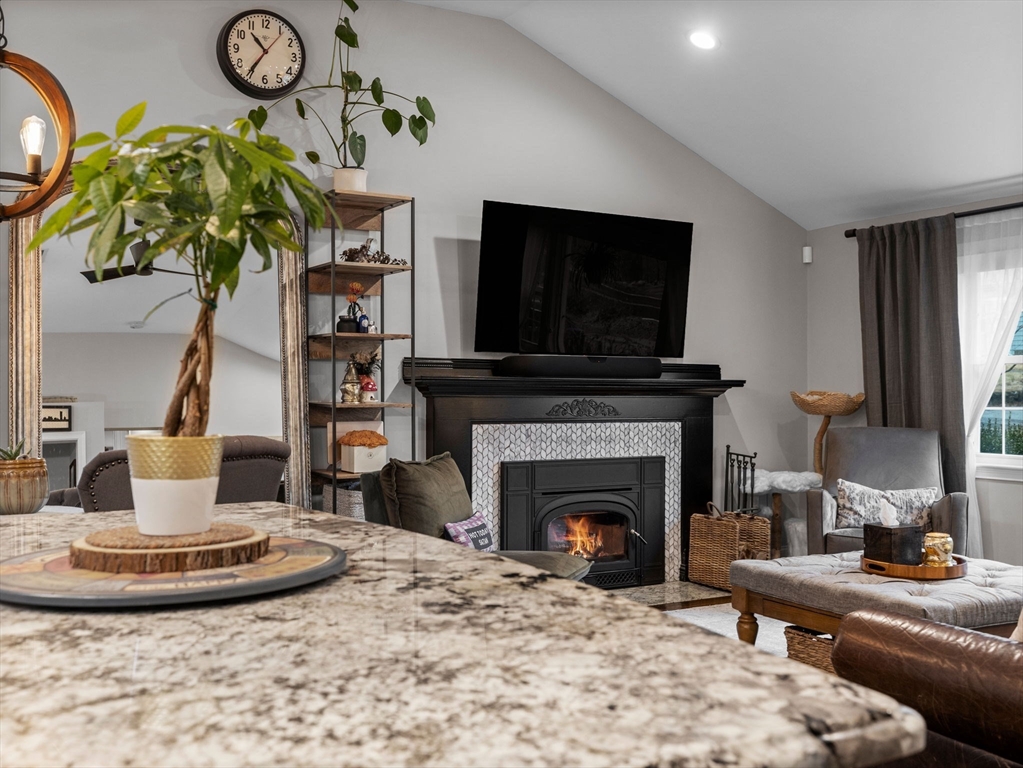 237 York Street Canton, MA 02021 - Photo 11 of 42 a living room with furniture a fireplace and a flat screen tv