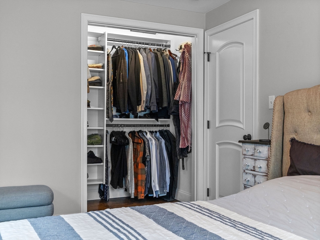 237 York Street Canton, MA 02021 - Photo 18 of 42 a view of walk in closet with clothes and shoes