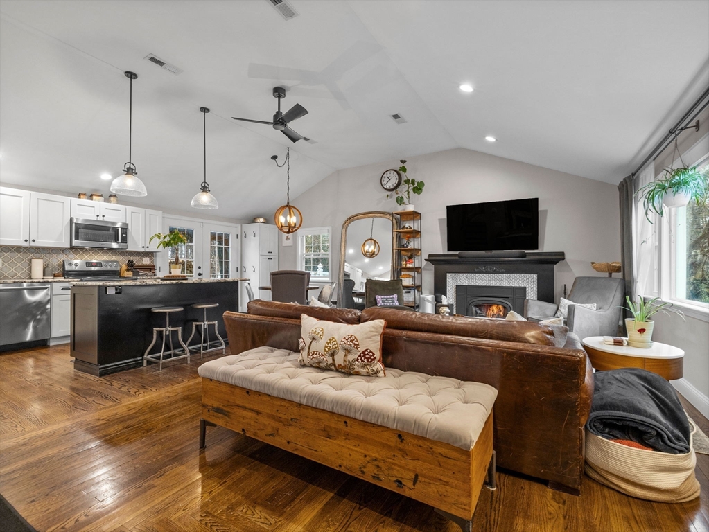 237 York Street Canton, MA 02021 - Photo 2 of 42 a living room with furniture a flat screen tv and kitchen view
