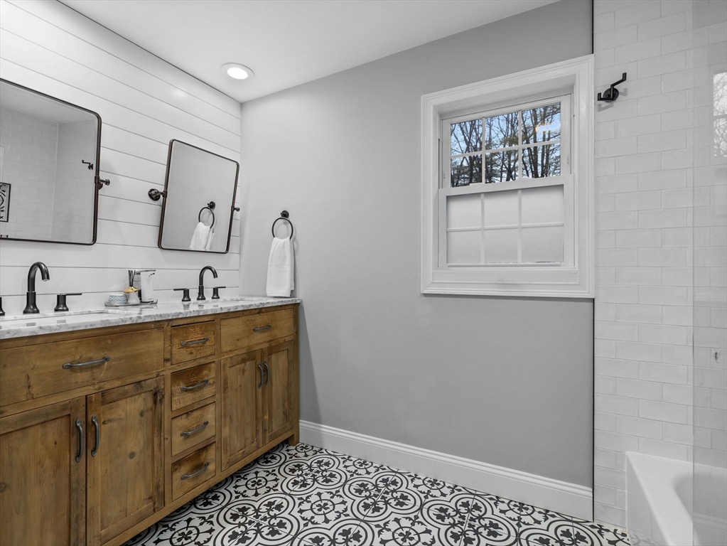 237 York Street Canton, MA 02021 - Photo 21 of 42 a bathroom with a sink mirror and vanity