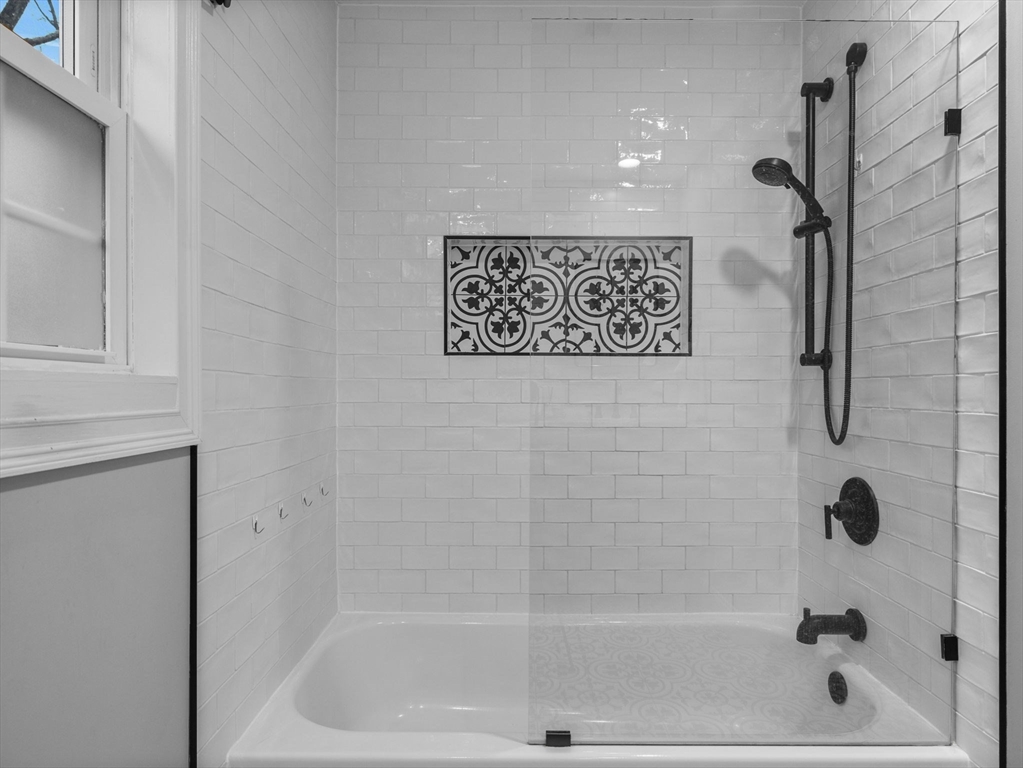 237 York Street Canton, MA 02021 - Photo 22 of 42 a bathroom with a shower and a bath tub
