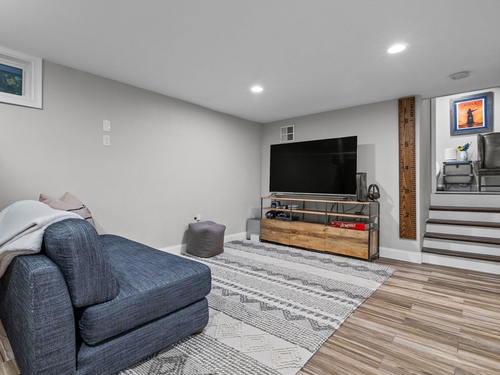 237 York Street Canton, MA 02021 - Photo 26 of 42 a living room with furniture and a flat screen tv