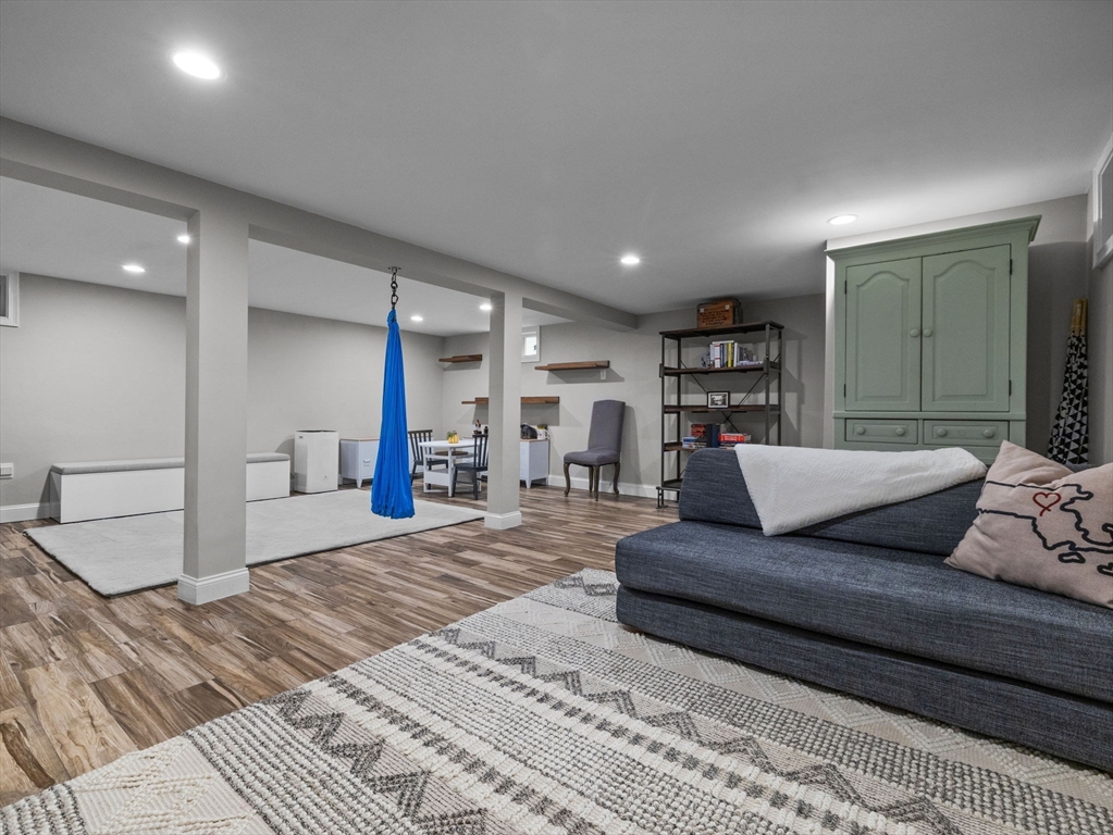 237 York Street Canton, MA 02021 - Photo 29 of 42 a spacious bedroom with a large bed and a couch