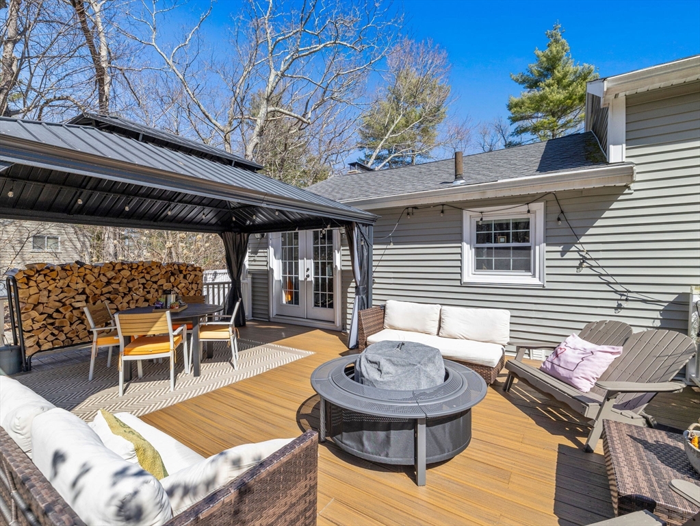 237 York Street Canton, MA 02021 - Photo 40 of 42 a view of a patio with table and chairs and potted plants