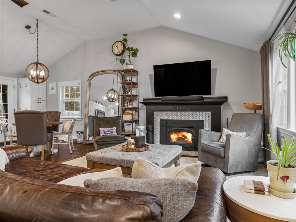 237 York Street Canton, MA 02021 - Photo 4 of 42 a living room with furniture a flat screen tv and a fireplace