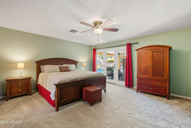a view of a backyard with plants and a patio
