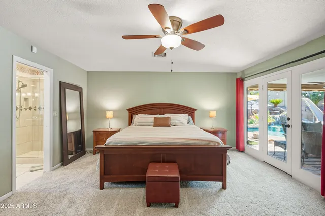 a view of a patio with couches table and chairs with wooden floor