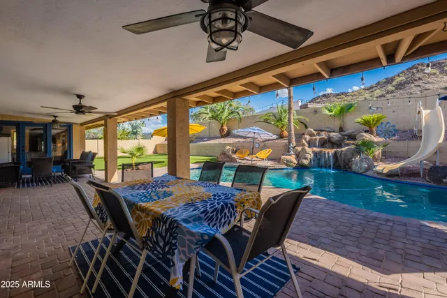 a view of a house with a backyard