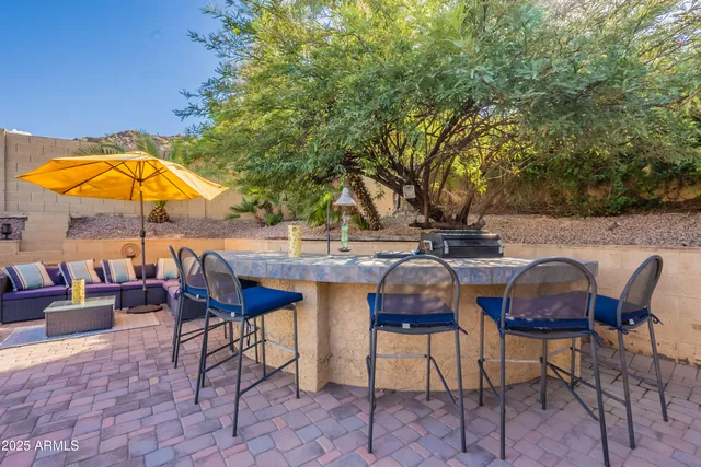 a aerial view of a house with a yard and sitting space