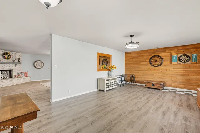 a kitchen with stainless steel appliances a sink stove refrigerator and cabinets