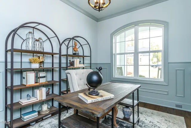 a view of a dining room with furniture and windows