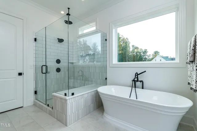 a bathroom with double vanity sinks and a mirror