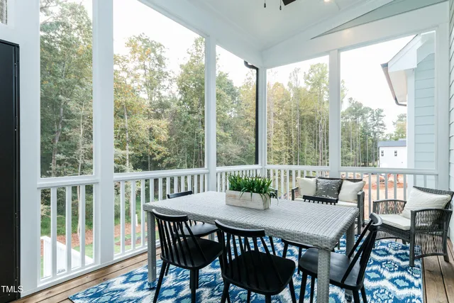 a bathroom with a sink a toilet a mirror and shower
