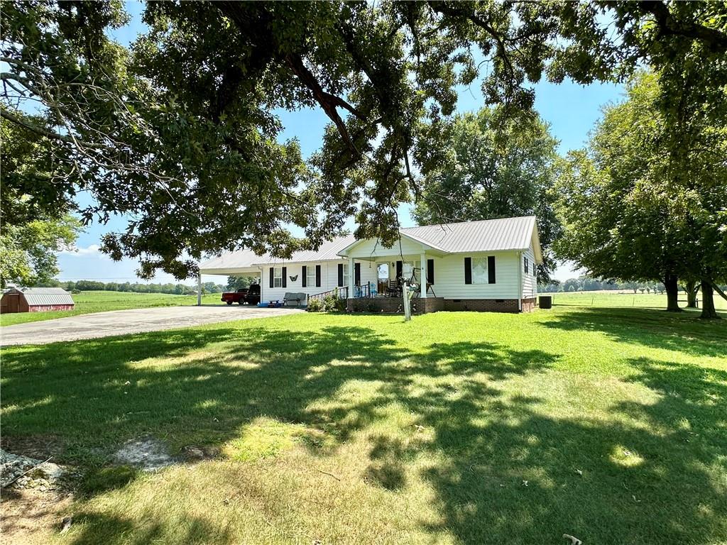 715 Beason Road Southeast Calhoun, GA 30701 - Photo 1 of 1 a front view of a house with yard and green space