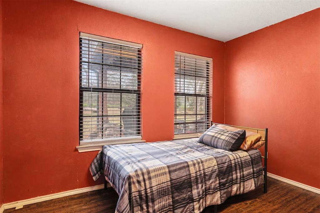 4315 Lakeshore Drive Reno, TX 75462 - Photo 16 of 20 a bedroom with a bed and wooden floor