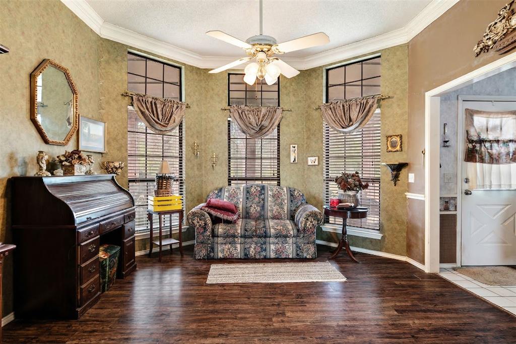 4315 Lakeshore Drive Reno, TX 75462 - Photo 5 of 20 a living room with furniture a fireplace and a chandelier