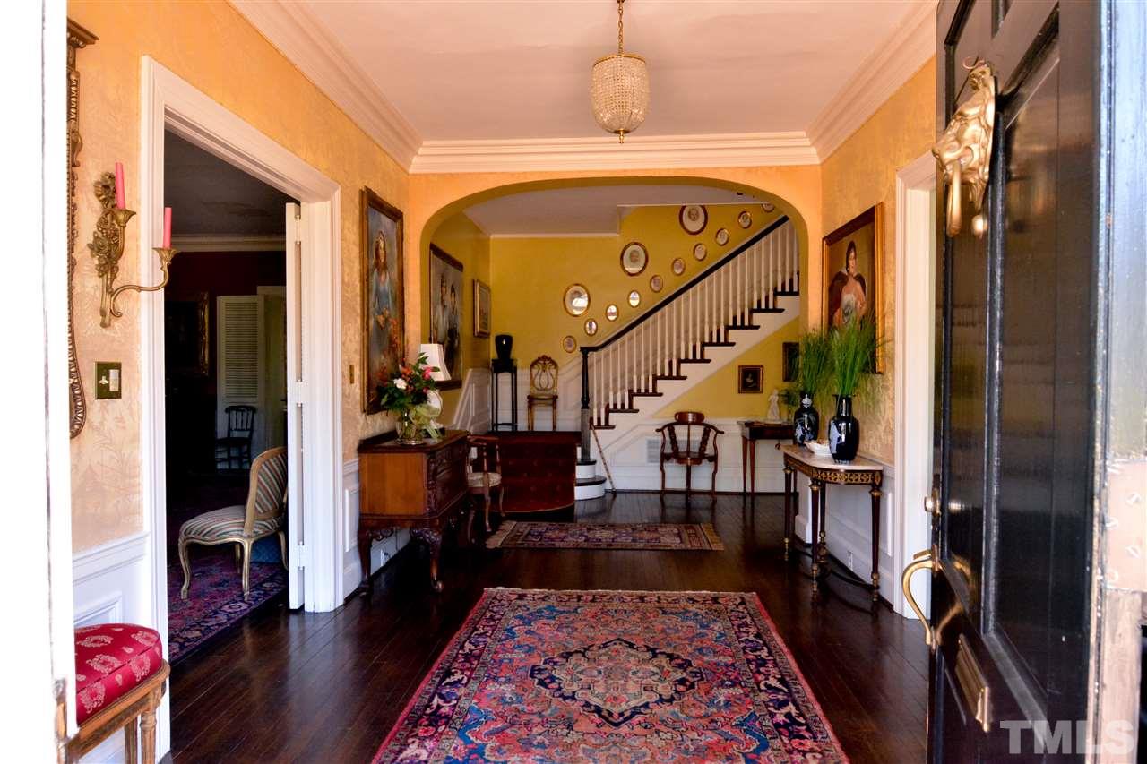 2120 White Oak Road Raleigh, NC 27608 - Photo 3 of 10 a view of an entryway with wooden floor and a rug