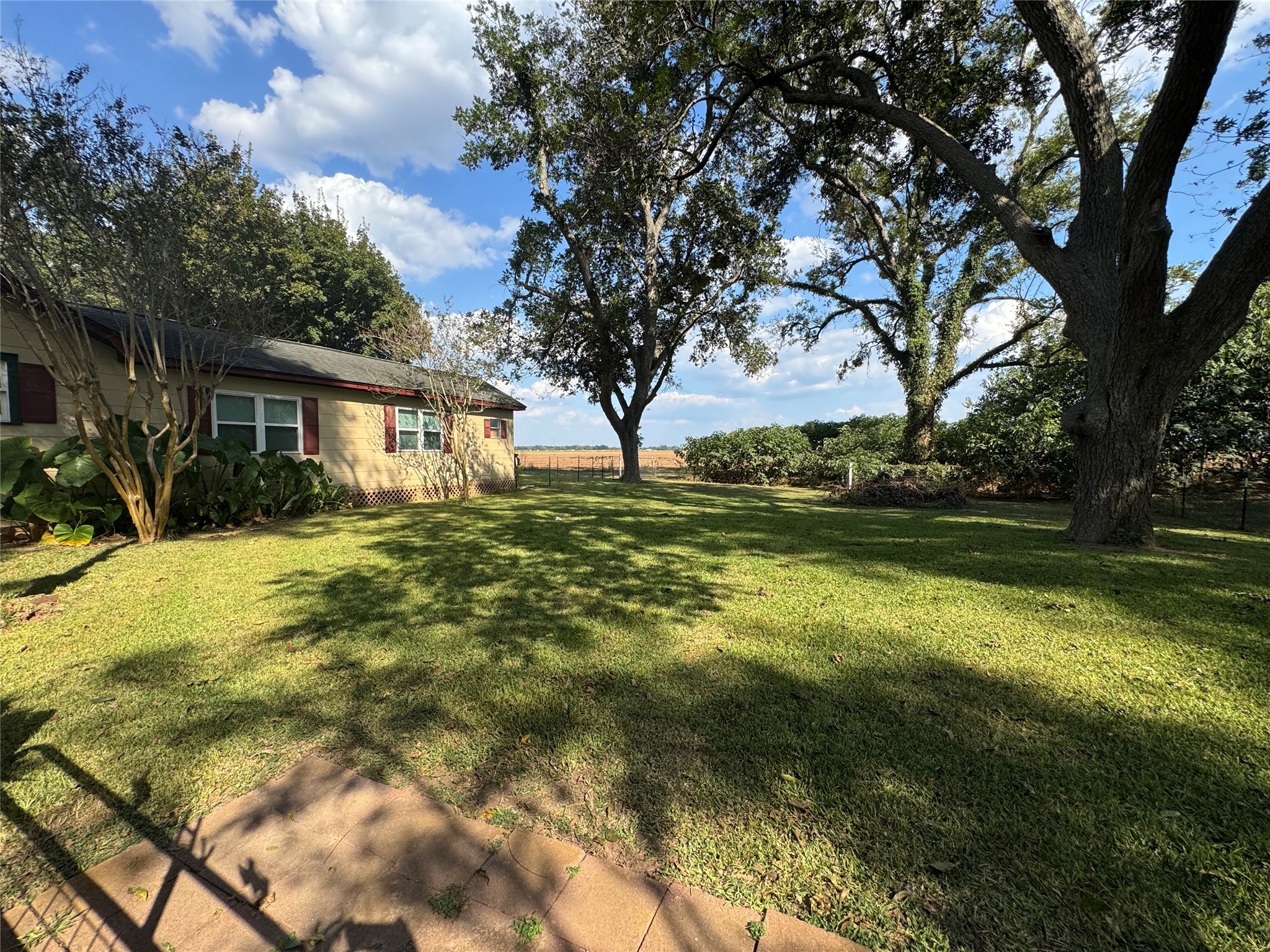 207 Elm Street Wharton, TX 77488 - Photo 2 of 27 Right side yard has its own fenced in area.