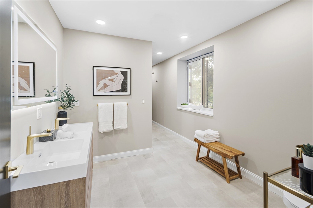 147 Sherman Street, Unit 201 Cambridge, MA 02140 - Photo 17 of 33 a living room with furniture and a wooden floor