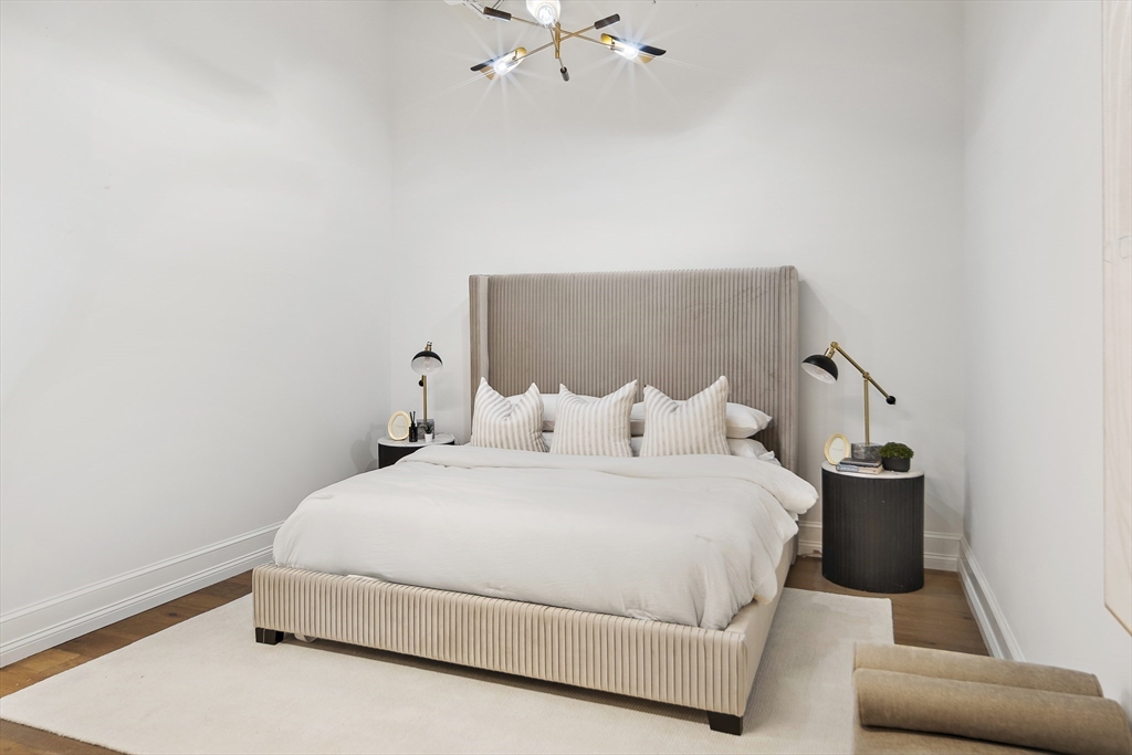 147 Sherman Street, Unit 201 Cambridge, MA 02140 - Photo 22 of 33 a bedroom with a bed and window