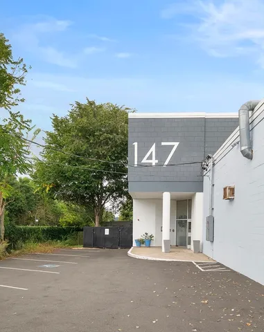 a view of a house with a outdoor space and street view