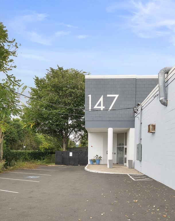 147 Sherman Street, Unit 201 Cambridge, MA 02140 - Photo 26 of 33 a view of a house with a outdoor space and street view