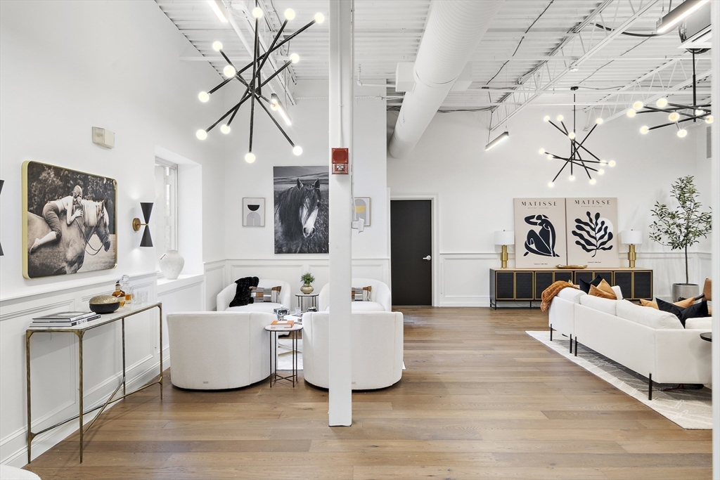 147 Sherman Street, Unit 201 Cambridge, MA 02140 - Photo 30 of 33 a living room with furniture and wooden floor