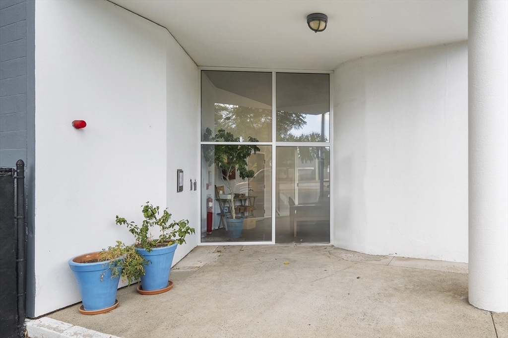 147 Sherman Street, Unit 201 Cambridge, MA 02140 - Photo 32 of 33 a view of an empty room with a window