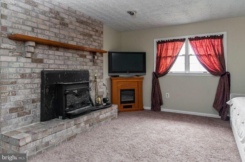 528 Beards Hill Road Aberdeen, MD 21001 - Photo 19 of 27 Cozy up in this spacious family room w/wood stove
