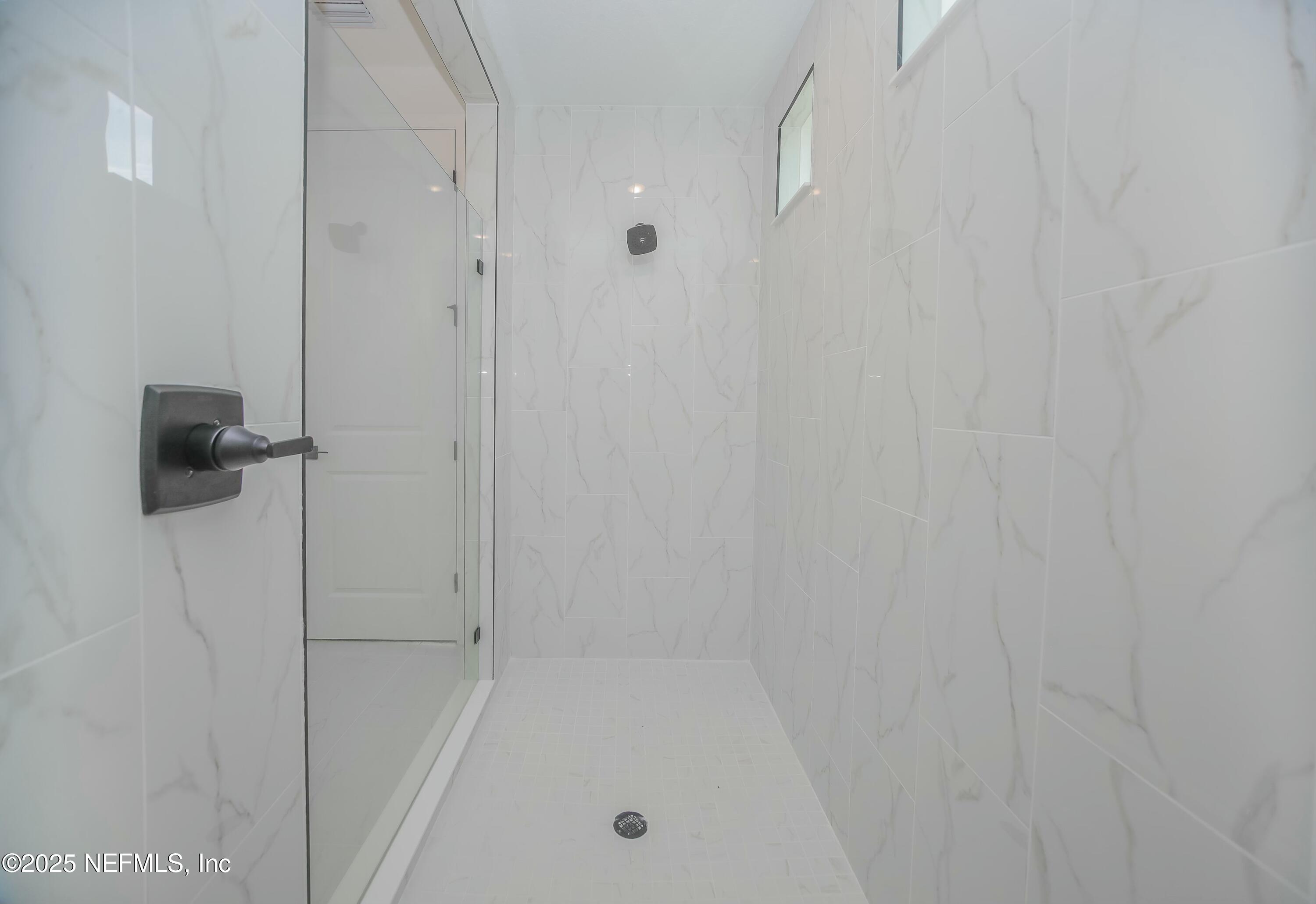 2526 Trailmark Drive St. Augustine, FL 32092 - Photo 14 of 46 a bathroom with a bathtub