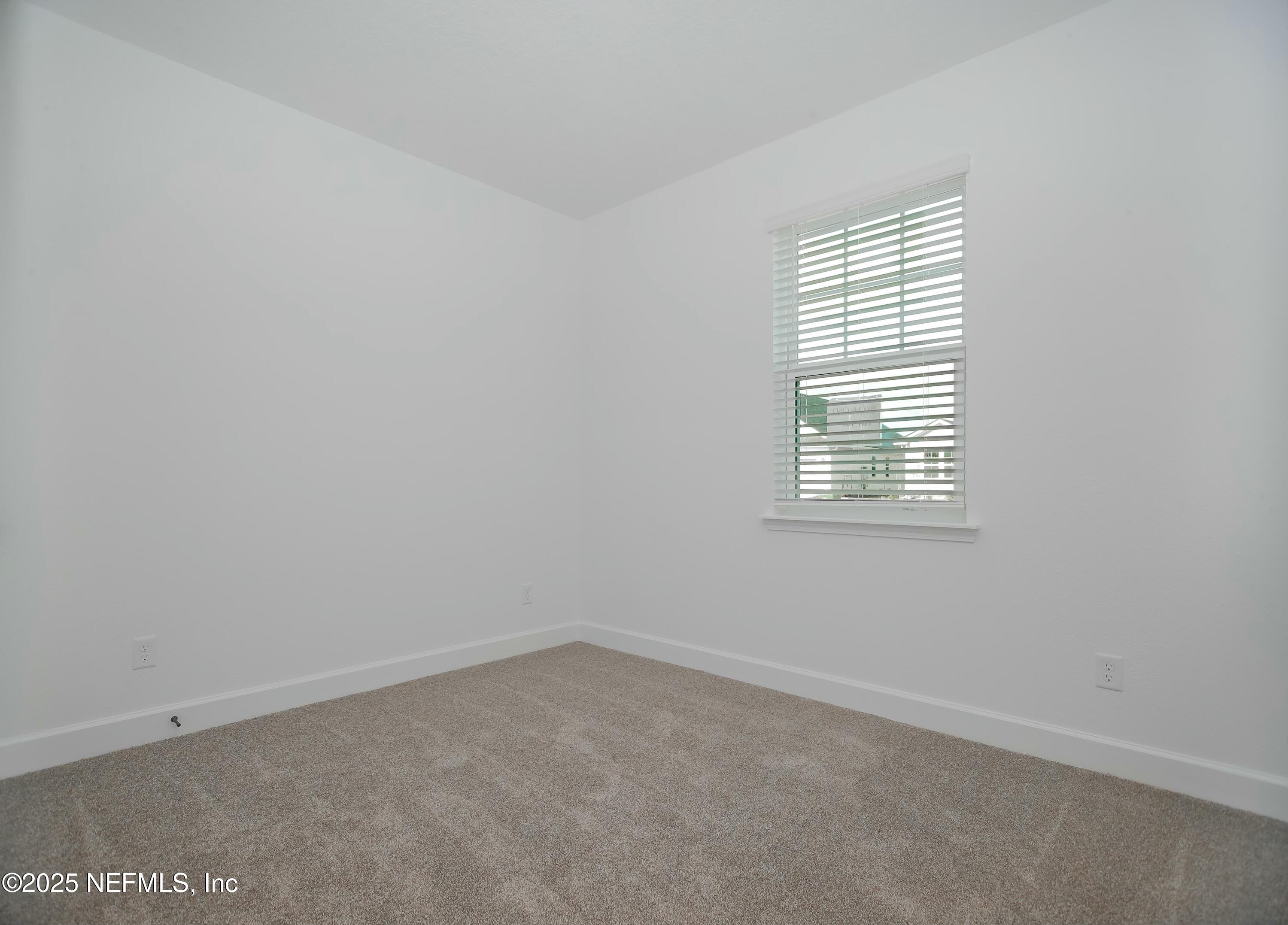 2526 Trailmark Drive St. Augustine, FL 32092 - Photo 16 of 46 an empty room with a window