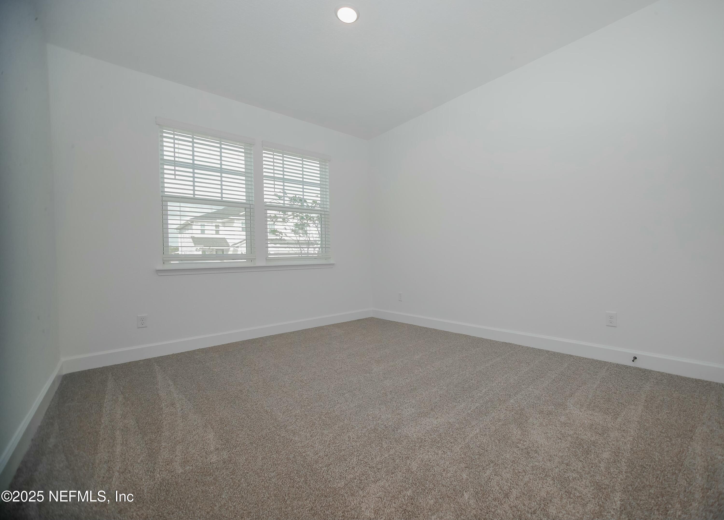 2526 Trailmark Drive St. Augustine, FL 32092 - Photo 20 of 46 an empty room with a window