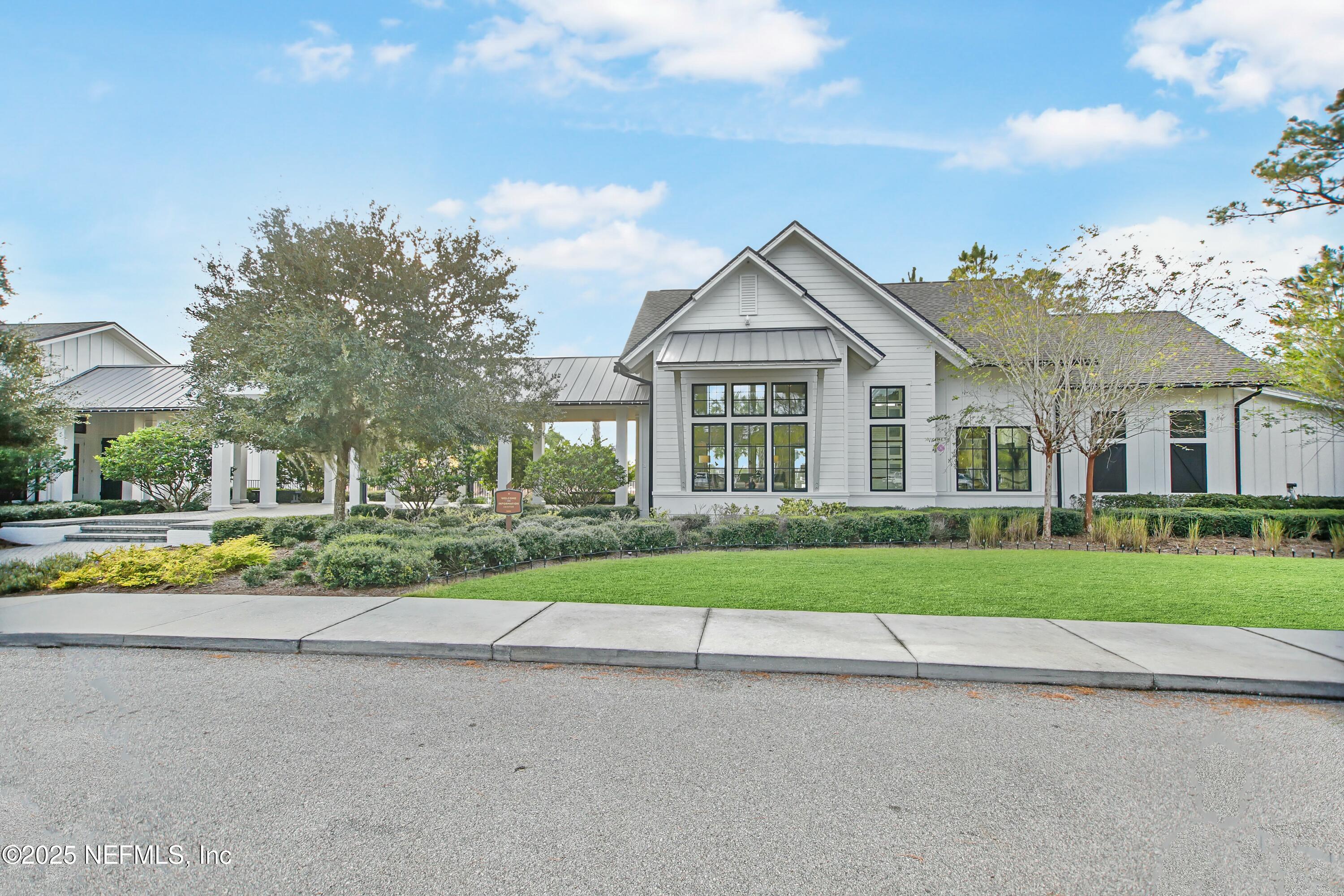 2526 Trailmark Drive St. Augustine, FL 32092 - Photo 28 of 46 front view of a house with a yard and an plants