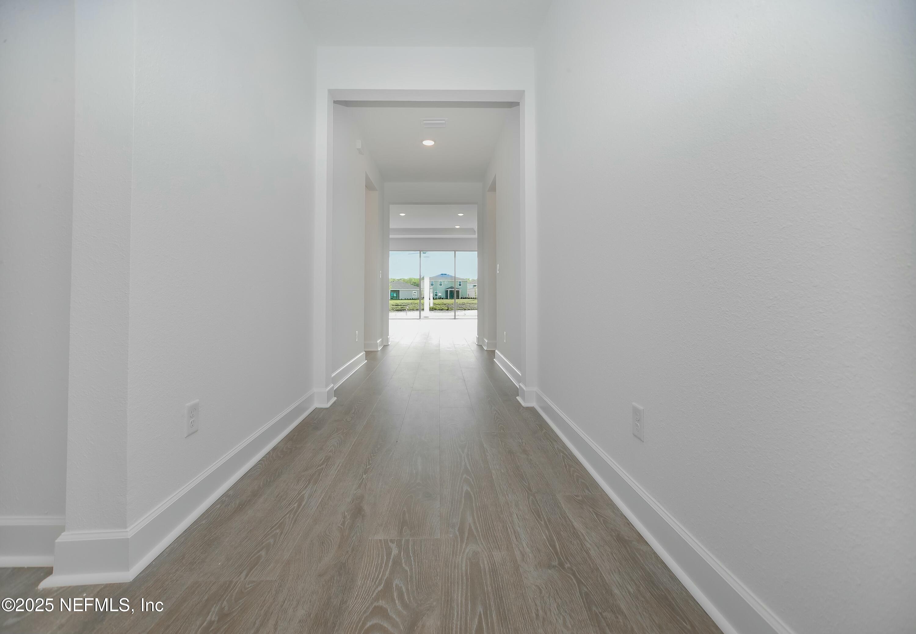2526 Trailmark Drive St. Augustine, FL 32092 - Photo 3 of 46 a view of a hallway with wooden floor