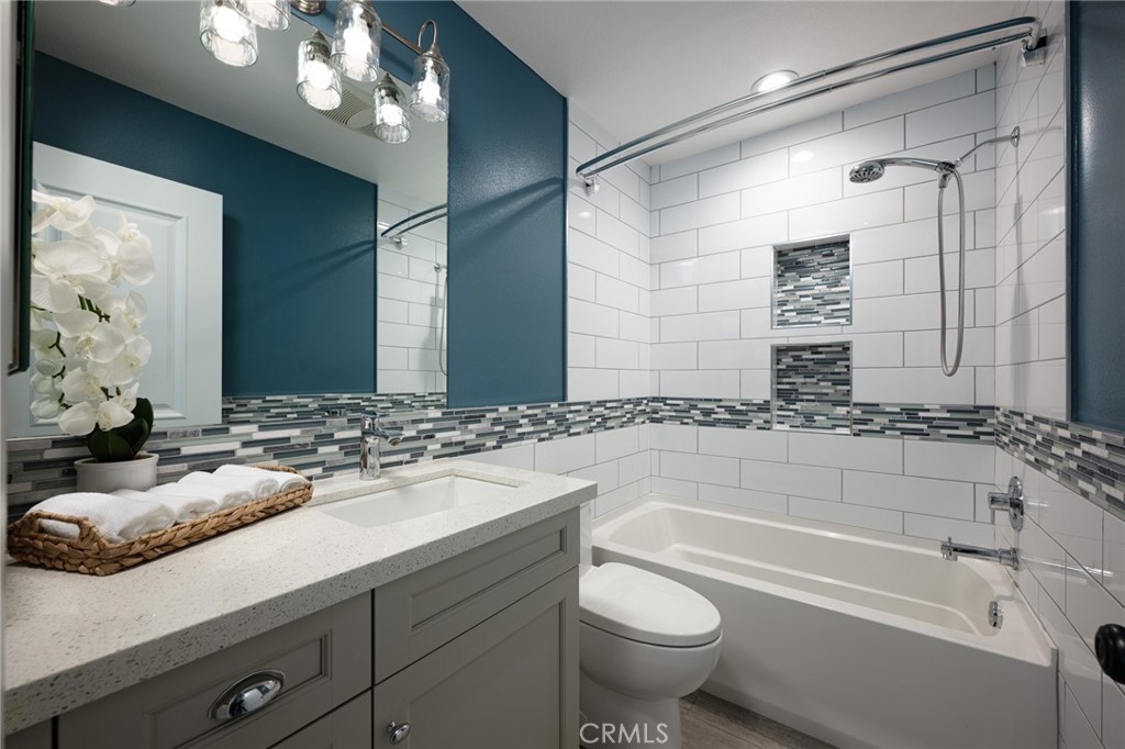 14241 Blackpool Road Westminster, CA 92683 - Photo 12 of 31 a bathroom with a bathtub and a sink
